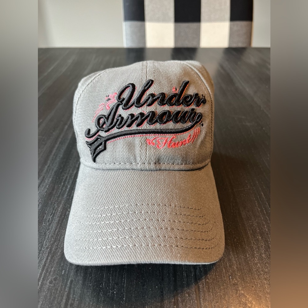 Grey Under Armour, women’s baseball cap. With pink detail.